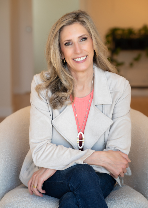 Woman in gray blazer jeans white office branding photography