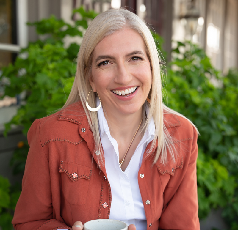 Branding photography of woman in orange with coffee cup green background