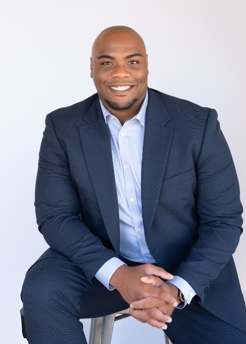 Black man in suit successful realtor young modern headshot