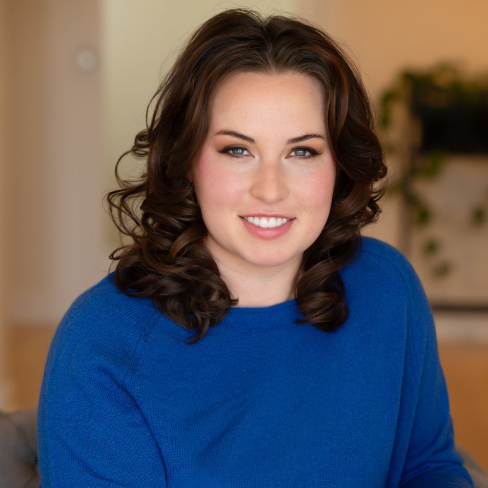 Young professional executive branding photograph in blue sweater with blue eyes